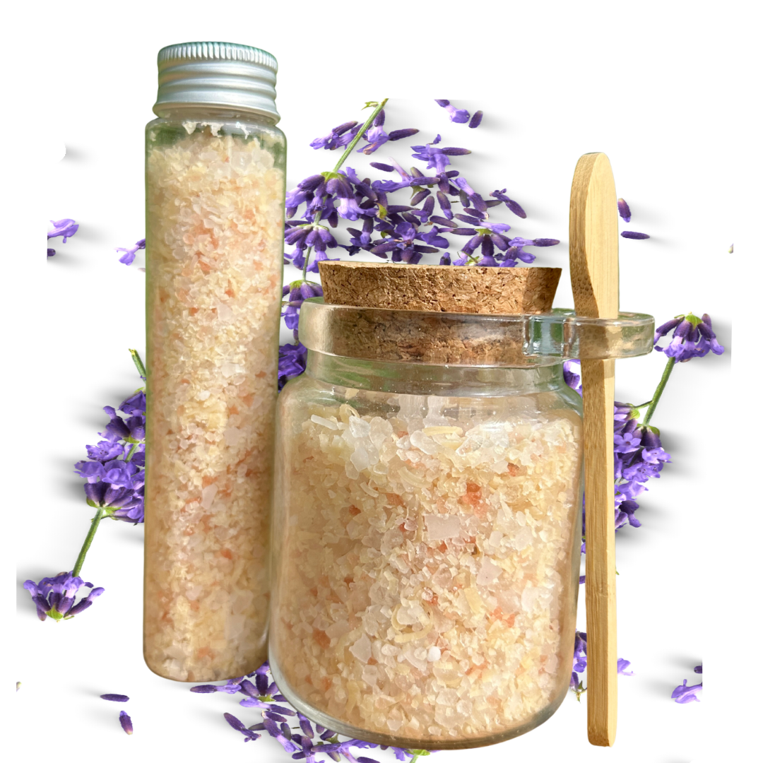 Jar of bath salt with a wooden spoon and lavender flowers on a white background