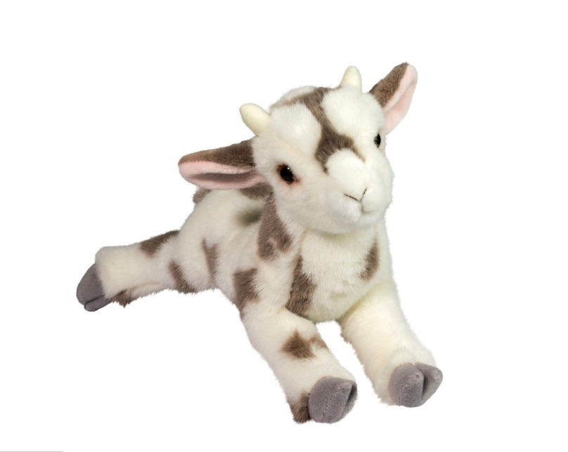 A plush stuffed baby goat toy lying down on a plain white background. The toy is white with brown patches, pink inner ears, and gray hooves.